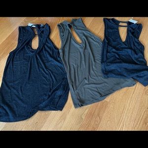 3 fitted size medium tanks. Price is for all 3